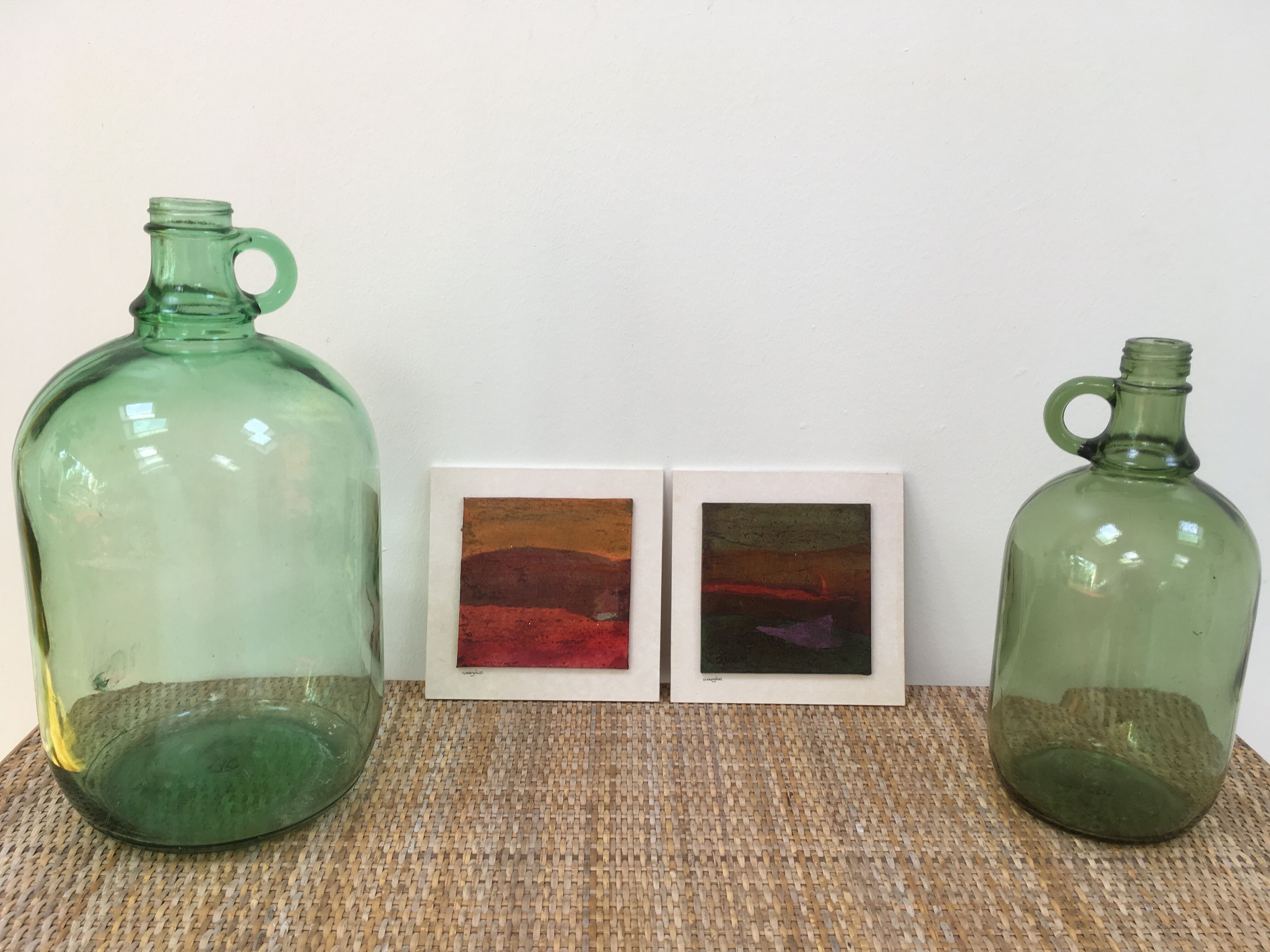 Pair of old demijohn bottles