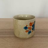 Speckled stoneware cup with blue flower