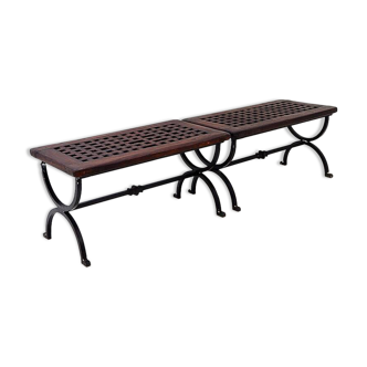Set of 2 solid wood benches with an openwork design and wrought iron legs.