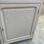 Beautiful art deco jam cupboard in delicate beige tone / and wicker basket