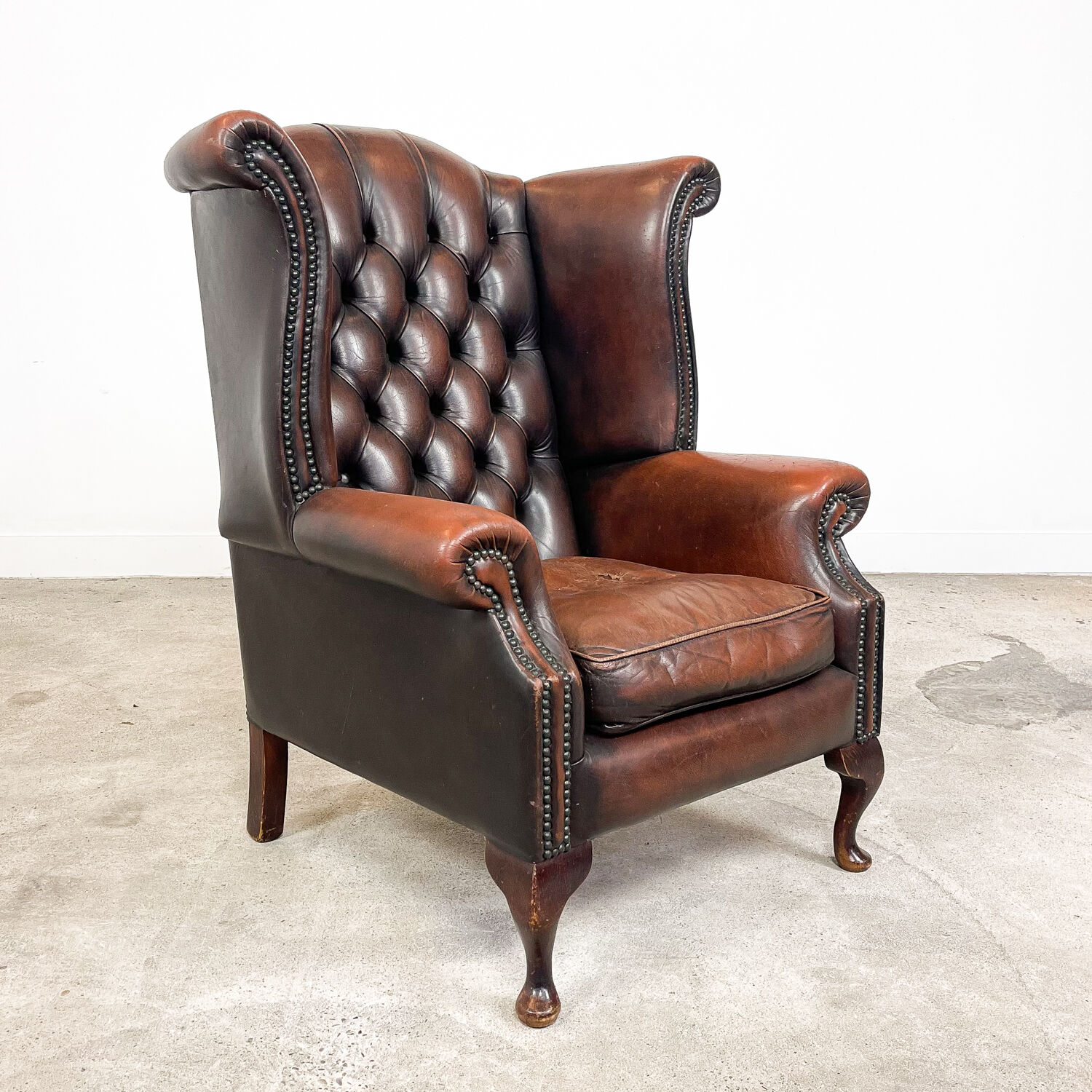 Vintage rustic dark brown leather chesterfield wingback armchair wassenaar