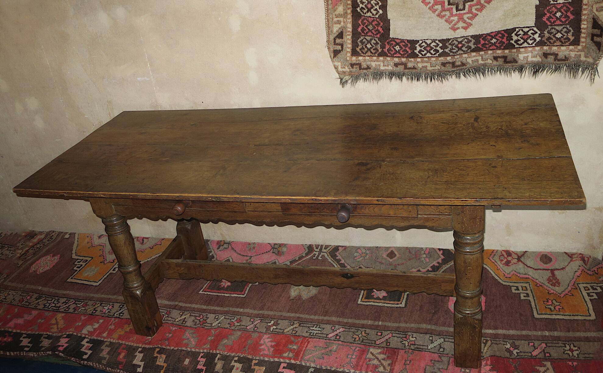 Antique patinated oak dining table, 18th century