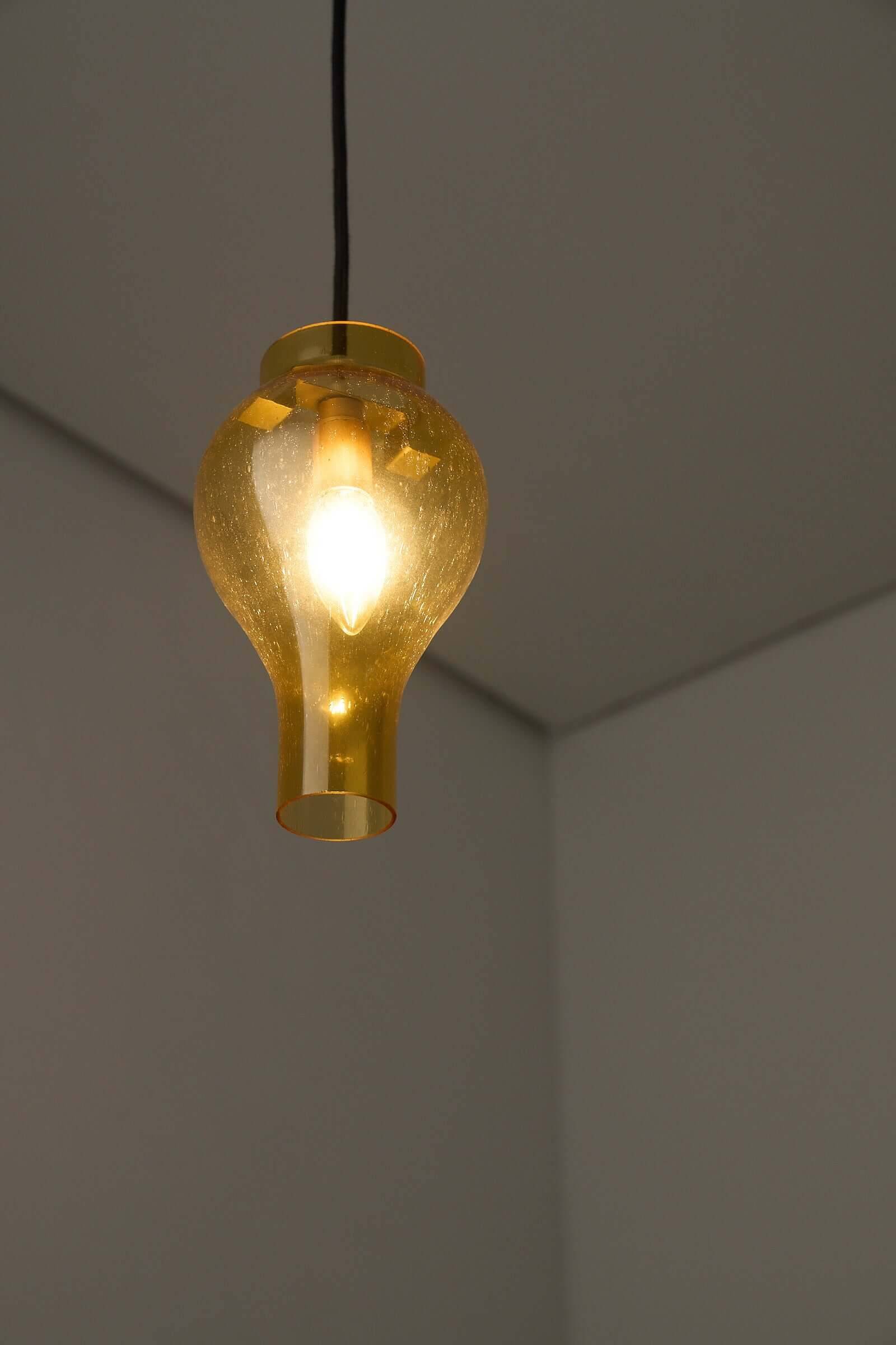 Yellow glass pendant lamp with bubbles