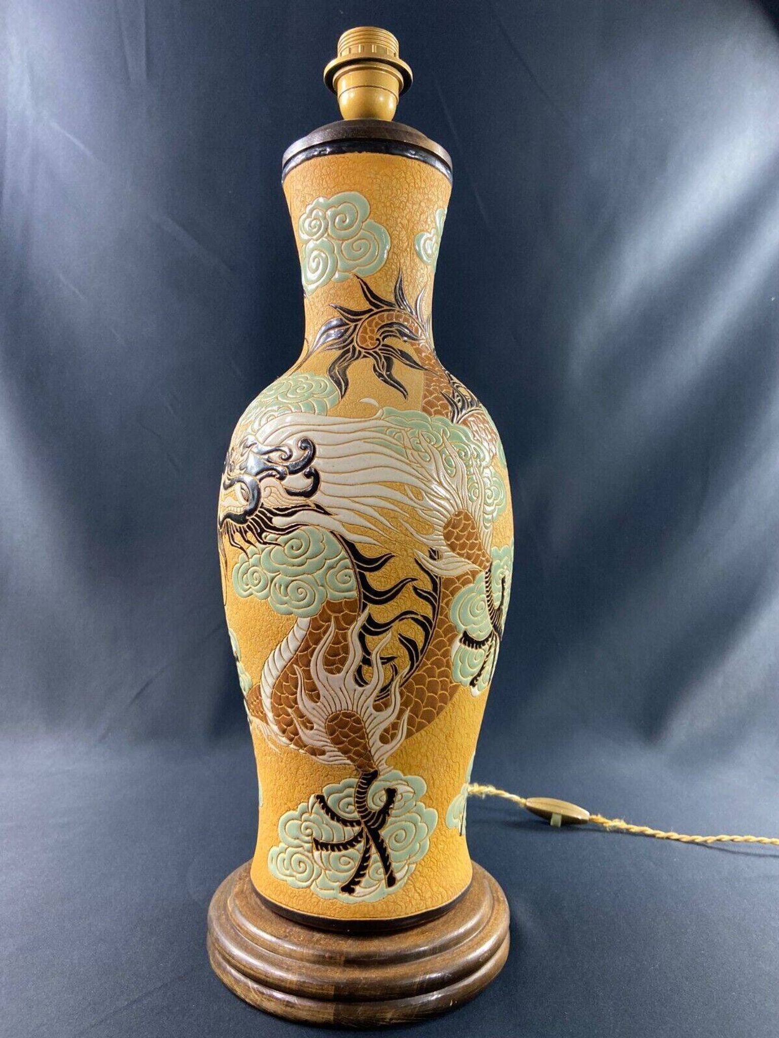 Very large dragon lamp on a yellow background in well-fired Vietnamese stoneware.