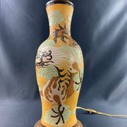 Very large dragon lamp on a yellow background in well-fired Vietnamese stoneware.