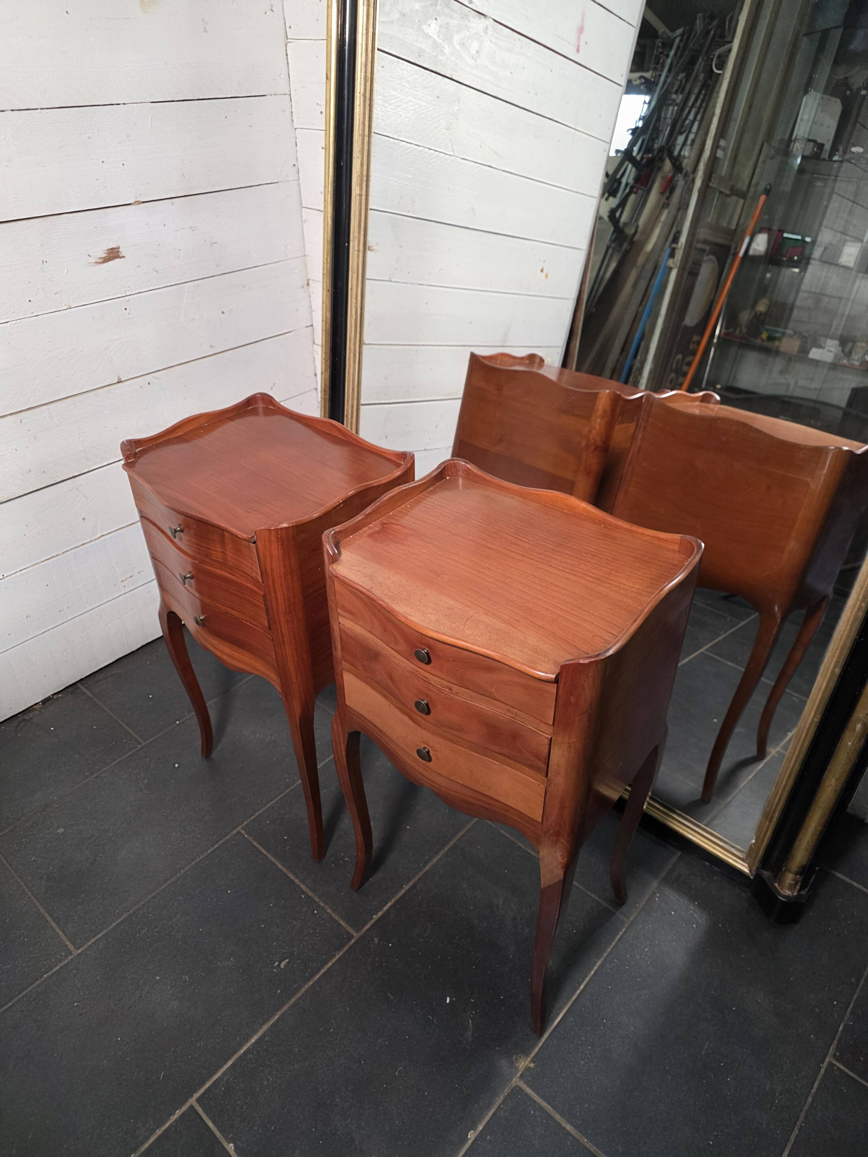 Pair of Louis XV style bedside tables in cherry wood.