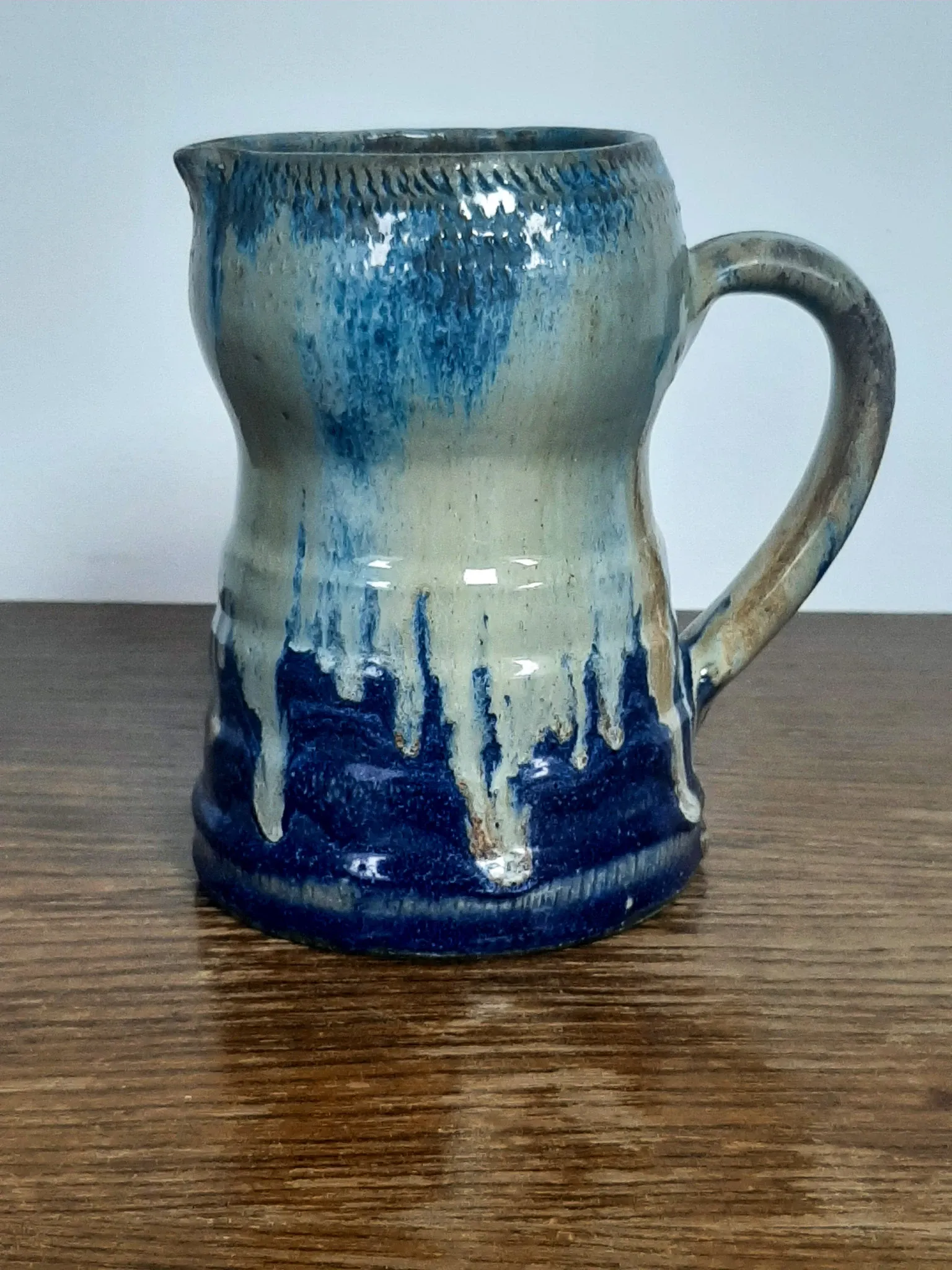 Blue flamed stoneware jug