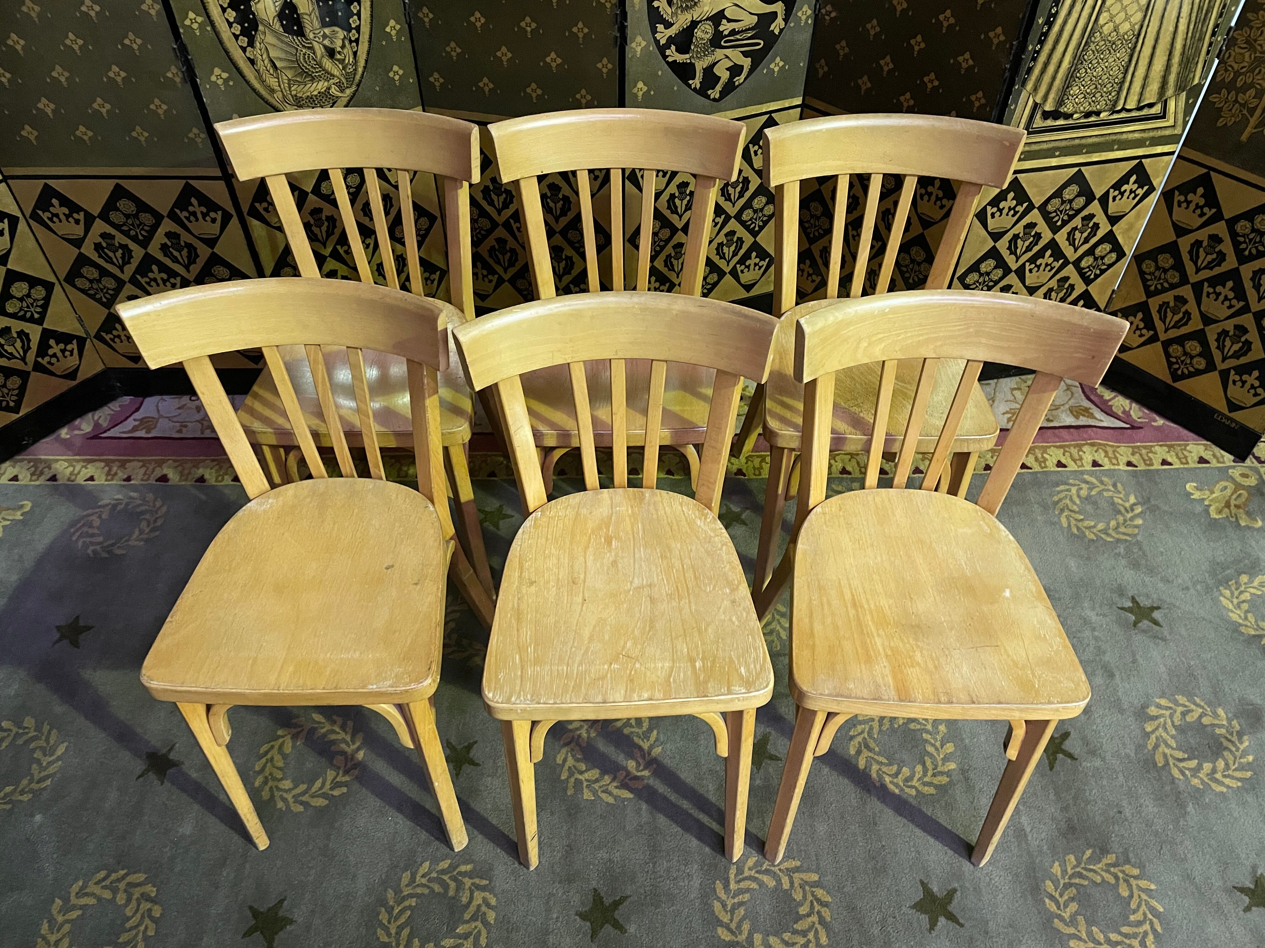 Suite of 6 bistro chairs signed "baumann"