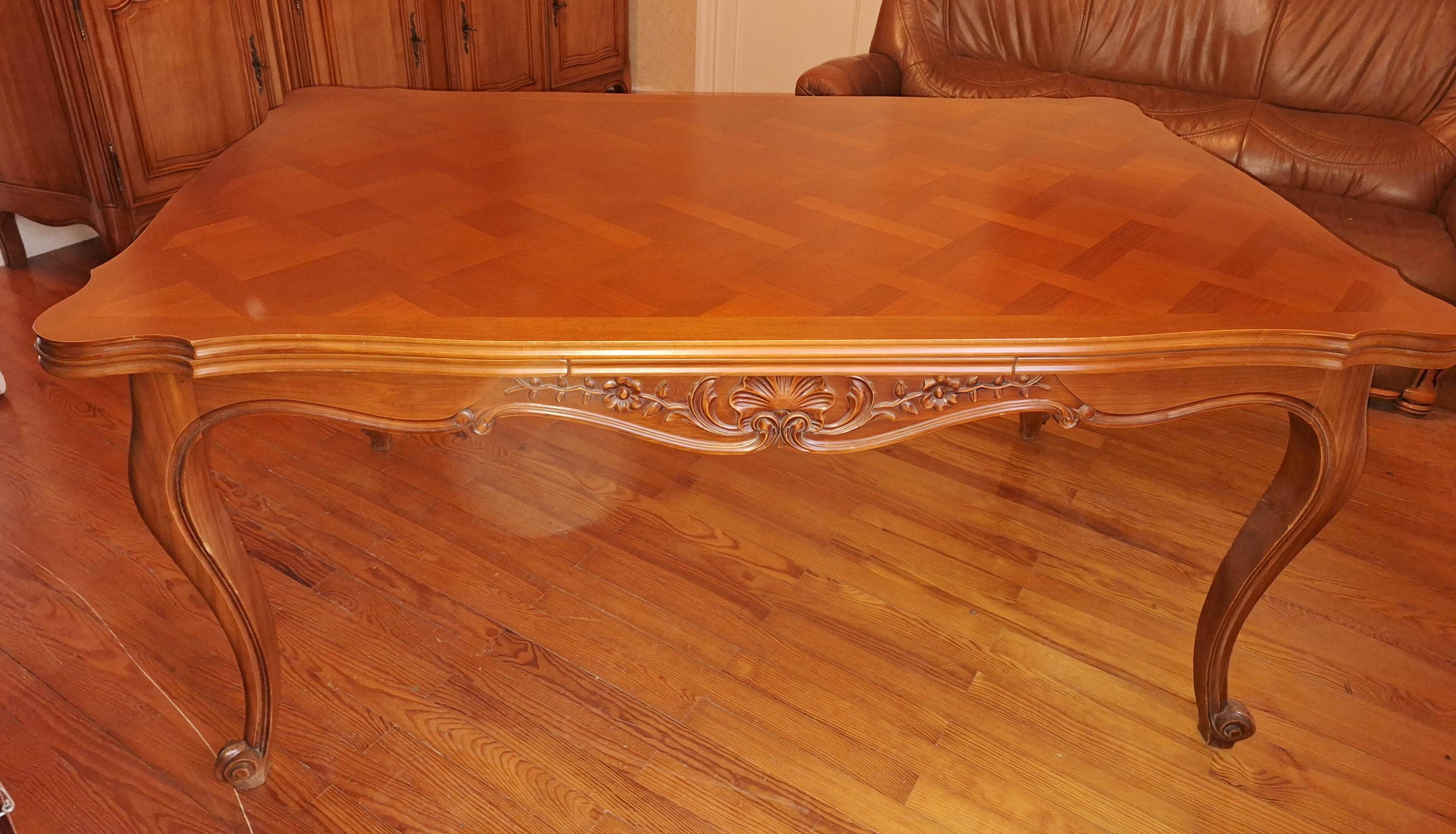 Extendable table in Louis XV style made of solid cherry wood and marquetry.