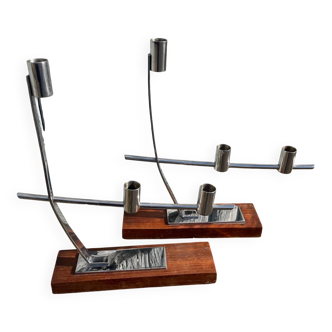 Two candle holders in stainless steel and wood.