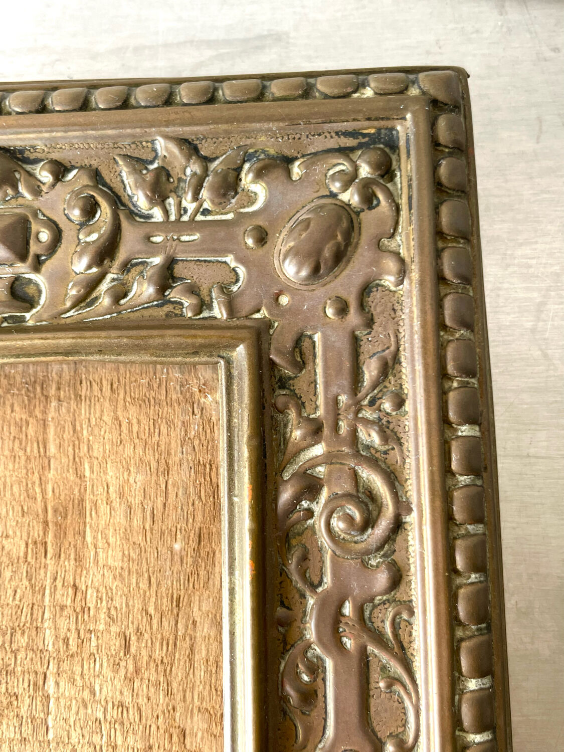 Antique brass metal picture frame in baroque style