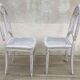 Pair of old white canne chairs