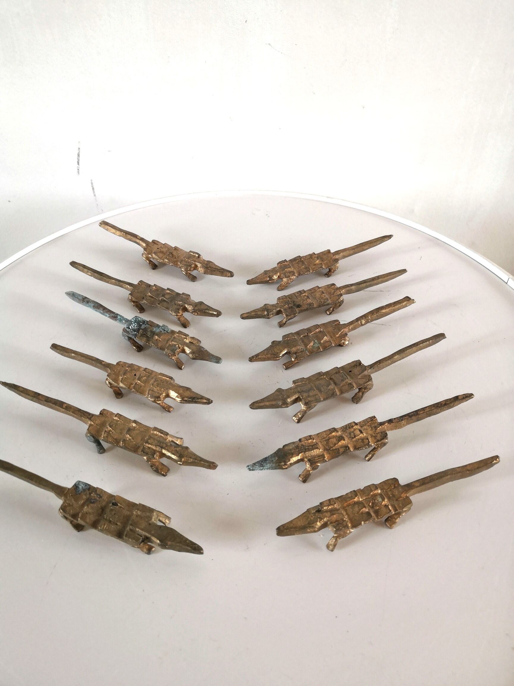 12 vintage bronze knife rests