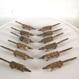 12 vintage bronze knife rests