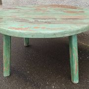 Round coffee table in old green wood