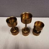 Three beautiful candle holders in solid brass, for block candles.