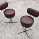 Set of 4 Mid Century Modern swivel chairs in tubular steel and leather.