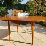 Round extendable teak dining table from the 60s
