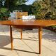 Round extendable teak dining table from the 60s