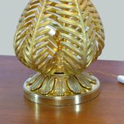 Lamp to lay on the foliage of golden ferns
