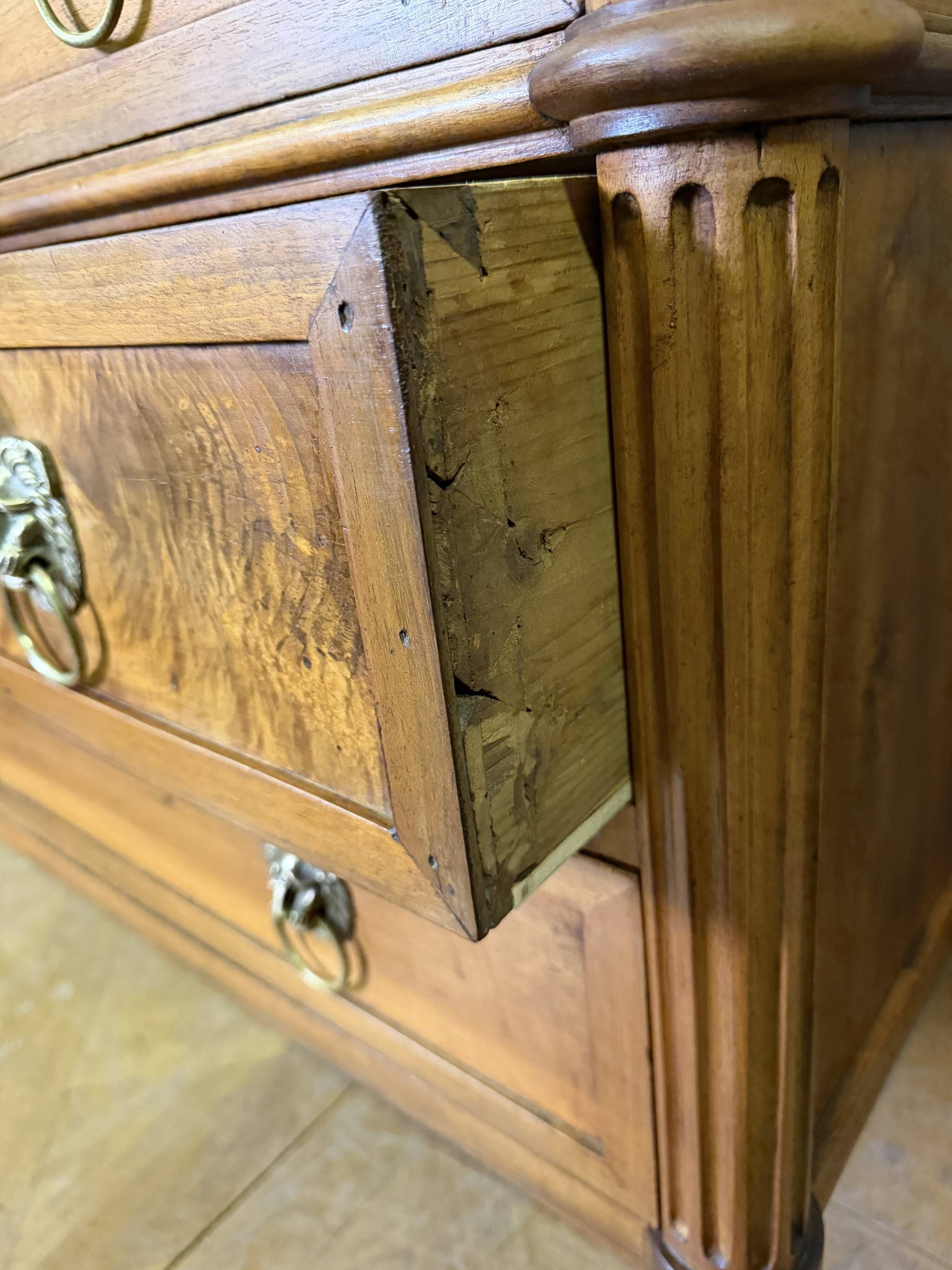 Louis XVI period commode in light walnut.