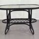 Black rattan and glass coffee table