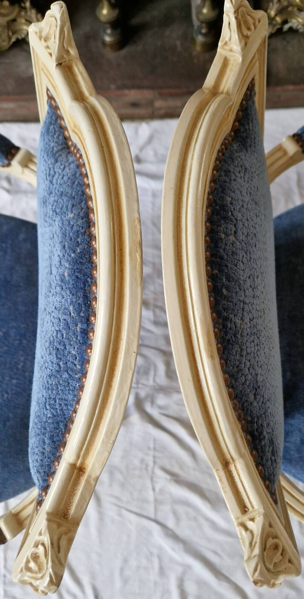 Pair of Louis XVI cabriolet armchairs in cream and blue French elegance late 19th century