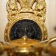 Pair of L'Originale wall sconces plated with 24-carat gold featuring four bronze candles.