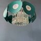 Suspension Space Age with glass shade and green/blue metal structure.