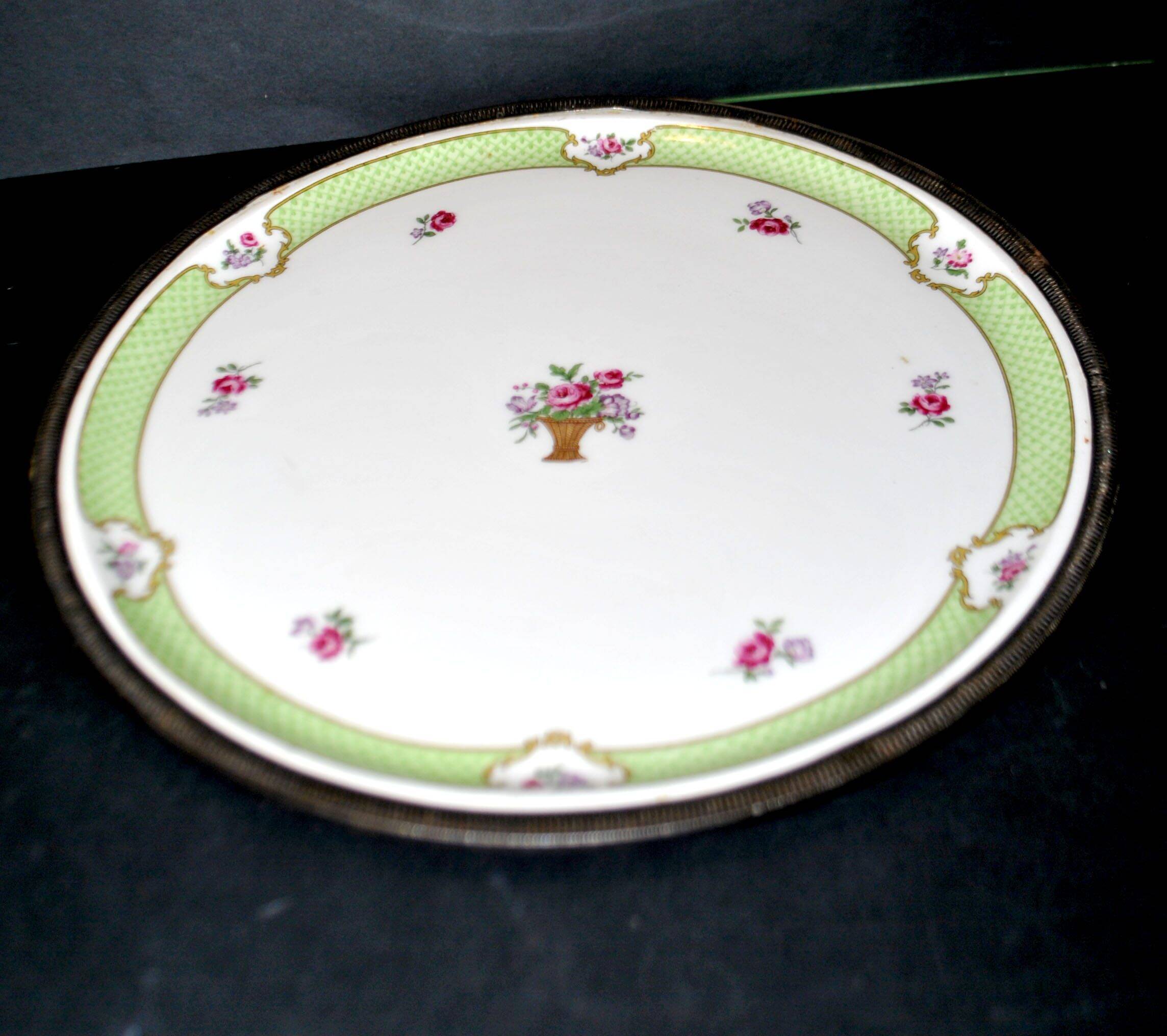 Haviland pie dish in Limoges porcelain with a Minerva silver rim.