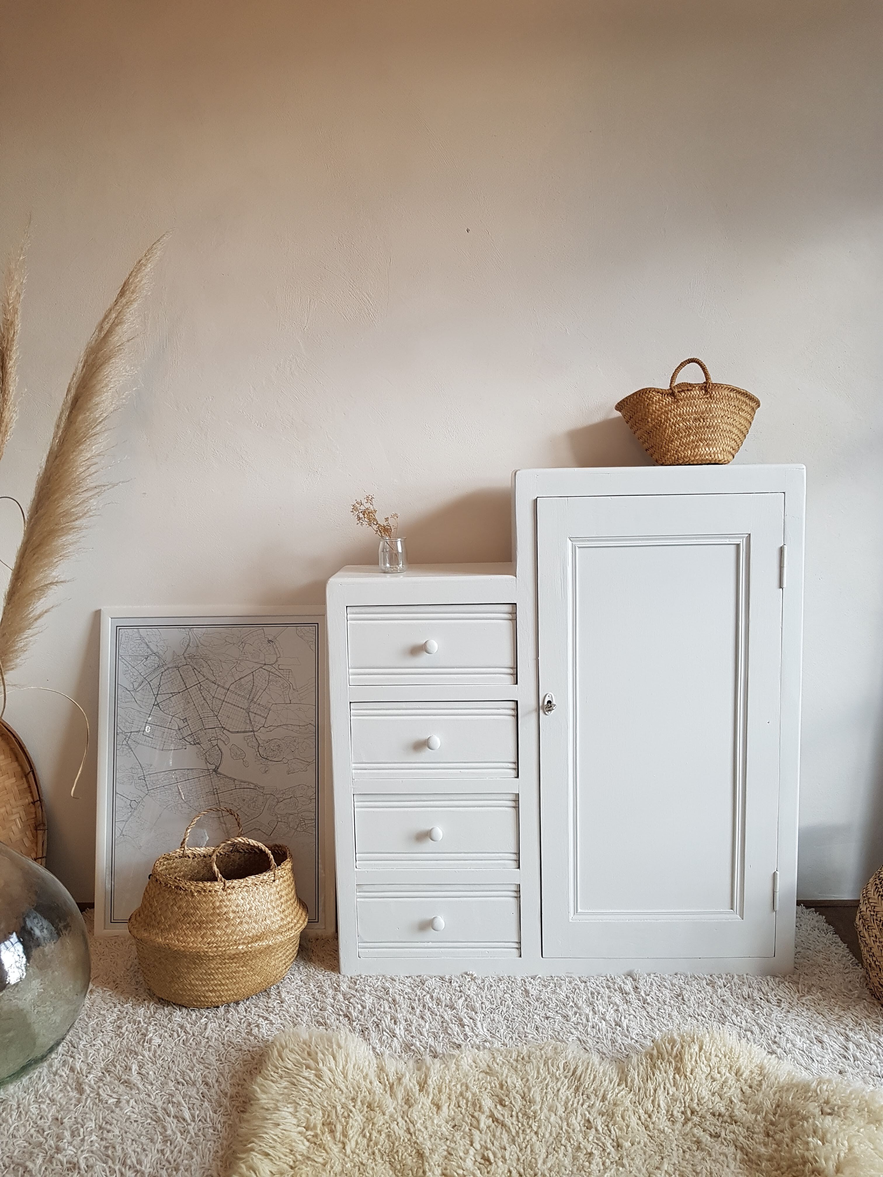 Old white asymmetrical chest of drawers