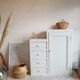 Old white asymmetrical chest of drawers