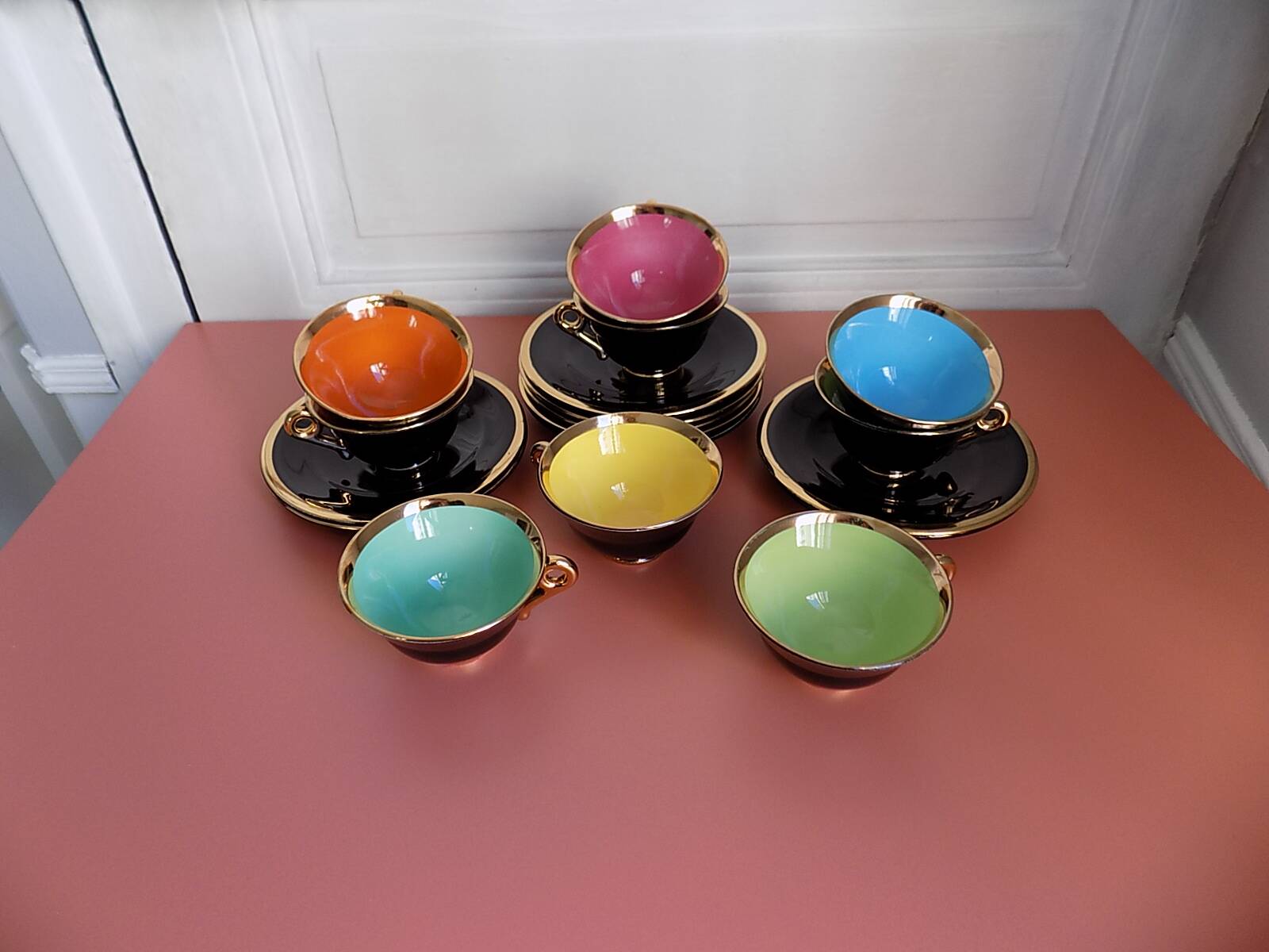 set of 9 black and gold Salins cups and saucers
