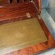 Antique mahogany secretary, upholstered flap and interior storage