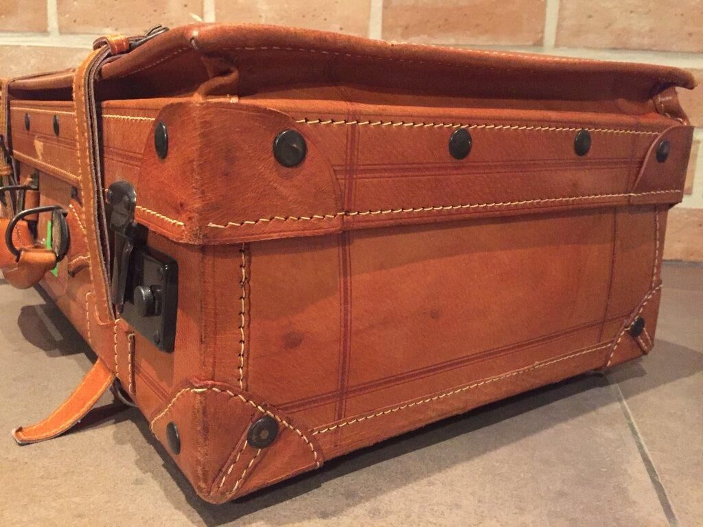 Thick leather suitcase