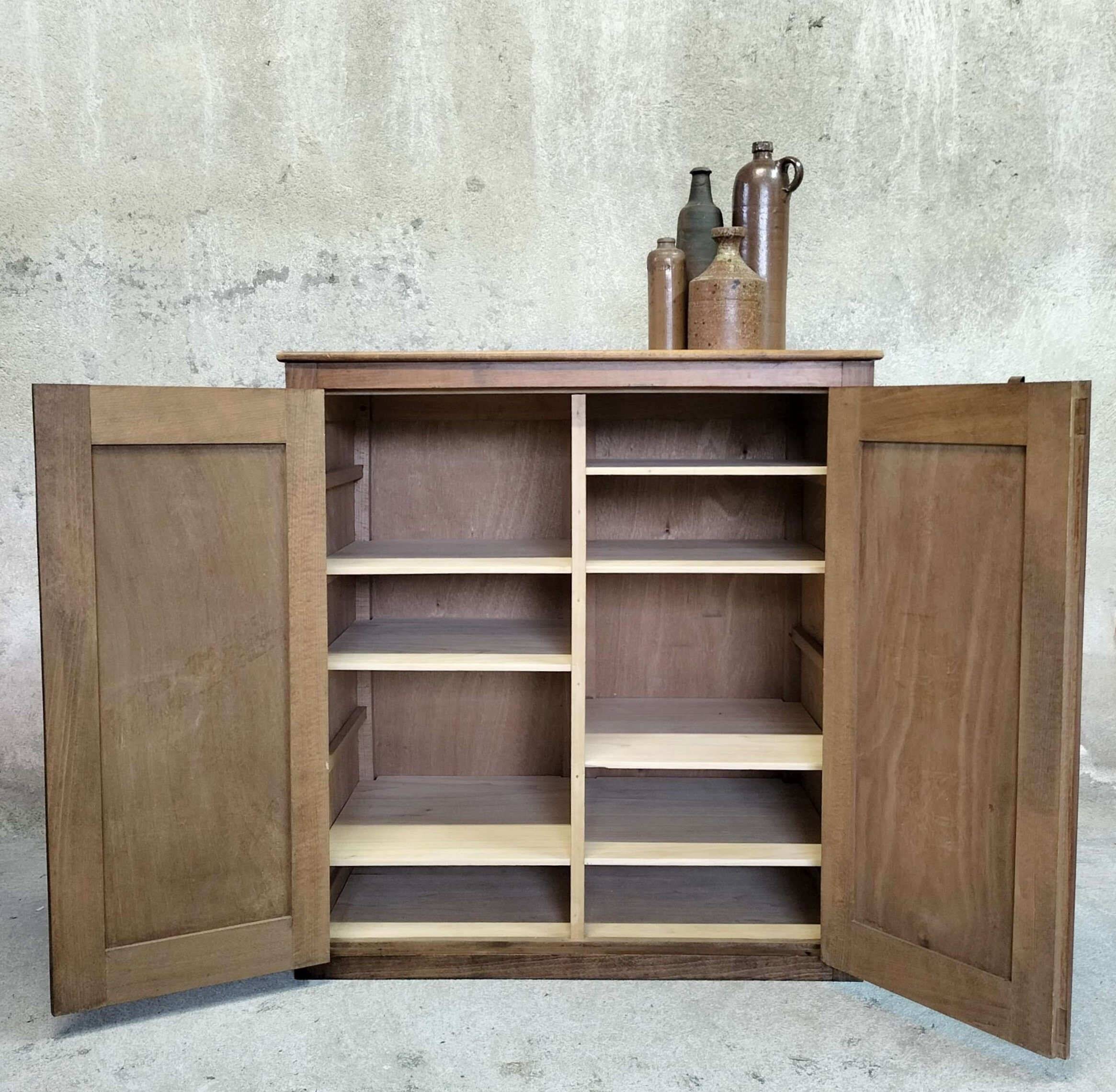 Small wooden sideboard with two doors.