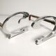 Pair of andirons in brushed steel and metal edition Jean-Paul Créations circa 1970