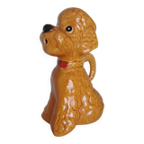 Ancient ceramic pitcher in the shape of a poodle.