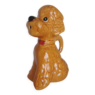 Ancient ceramic pitcher in the shape of a poodle.