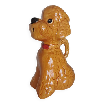 Ancient ceramic pitcher in the shape of a poodle.