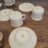 5 enameled stoneware cups and saucers