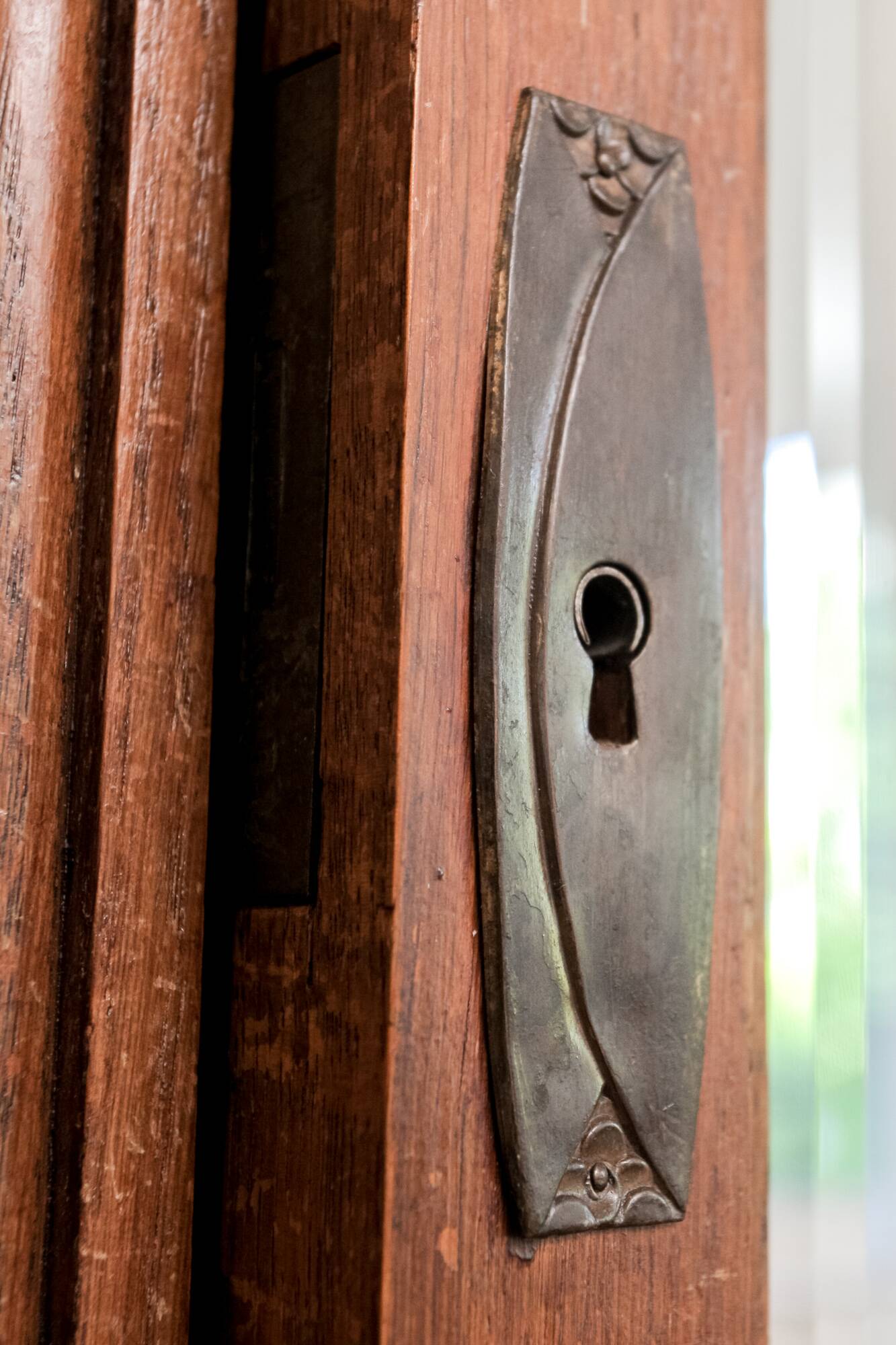Old solid wood wardrobe with three vintage mirror doors