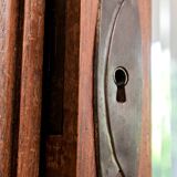 Old solid wood wardrobe with three vintage mirror doors