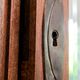 Old solid wood wardrobe with three vintage mirror doors