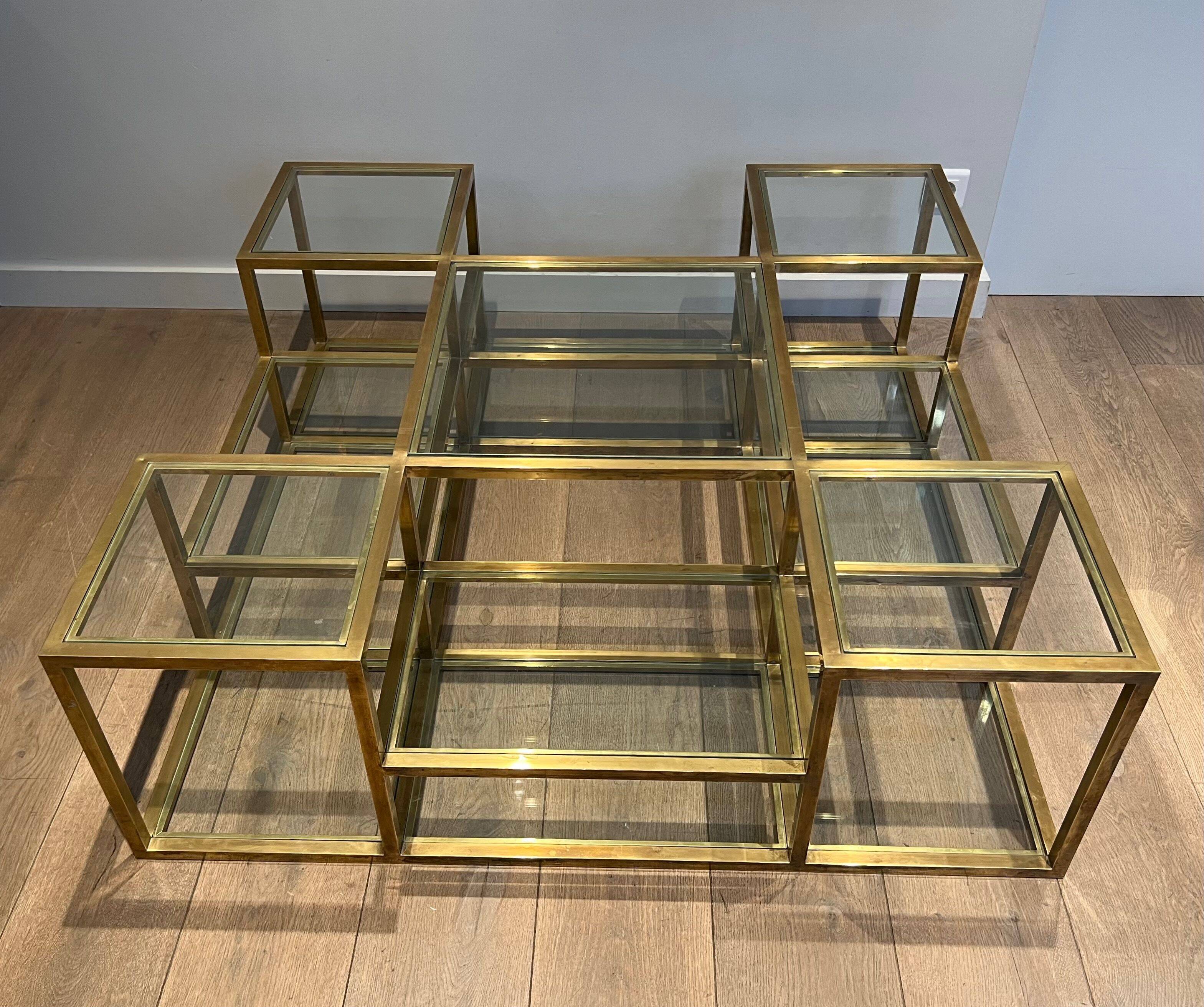 Important brass coffee table with multiple levels.