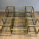 Important brass coffee table with multiple levels.