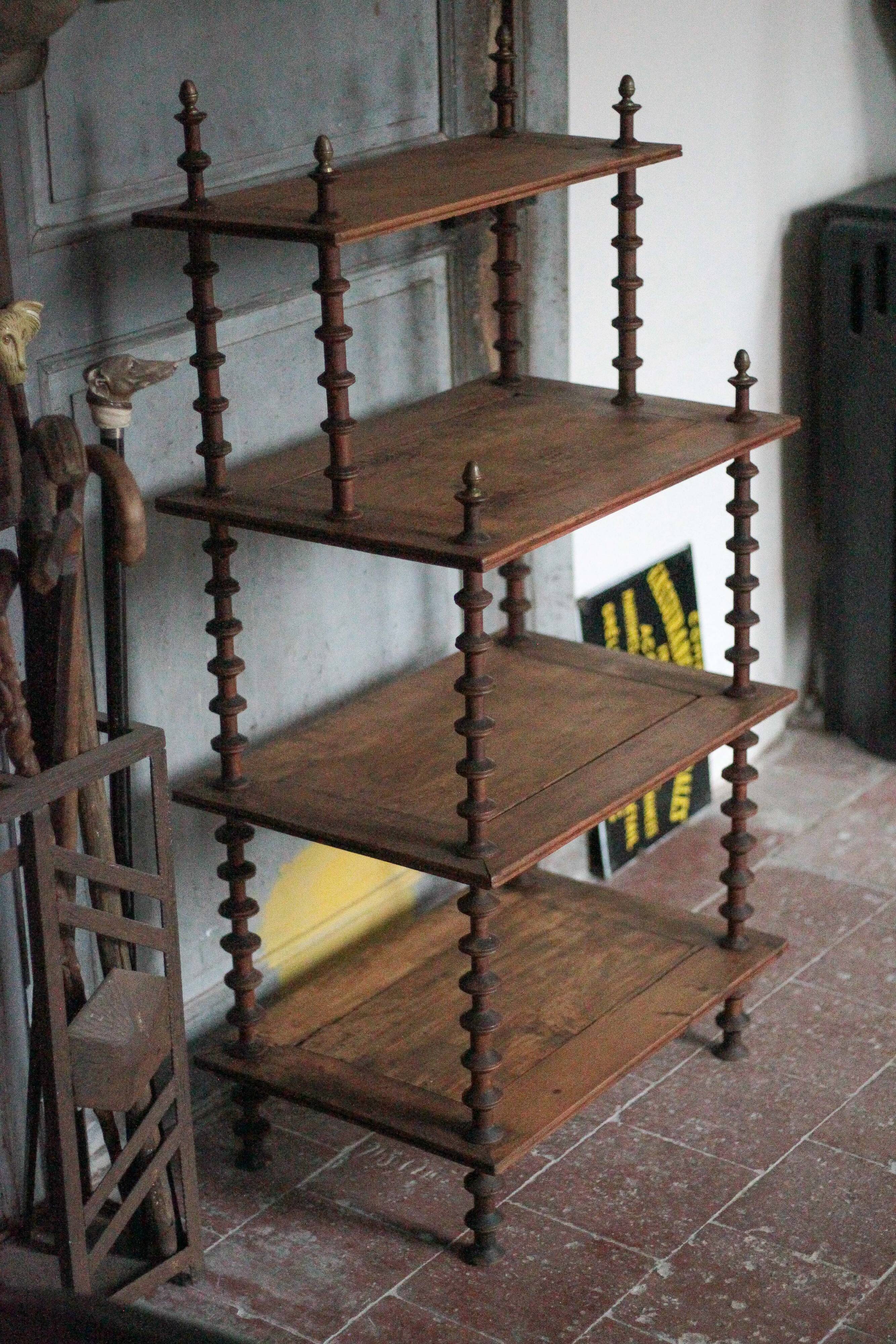 Napoleon III spool shelf, floor-standing shelf with brass tips.