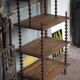 Napoleon III spool shelf, floor-standing shelf with brass tips.