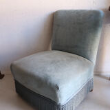 Vintage blue velvet fringed armchair.