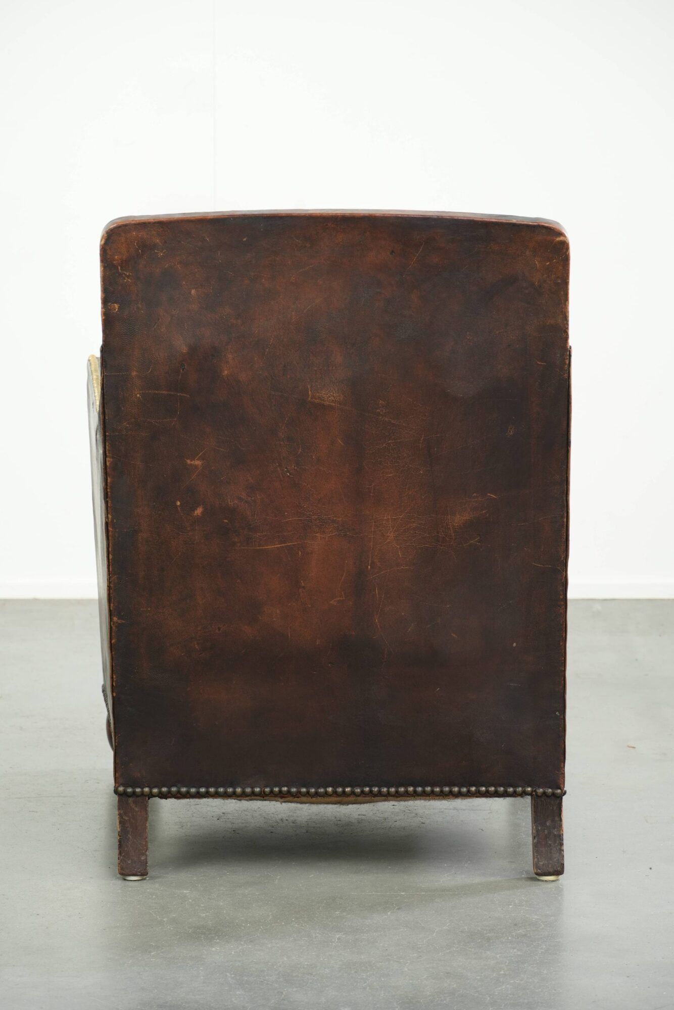 Art Deco design armchair finished in velvet and fitted with decorative nails